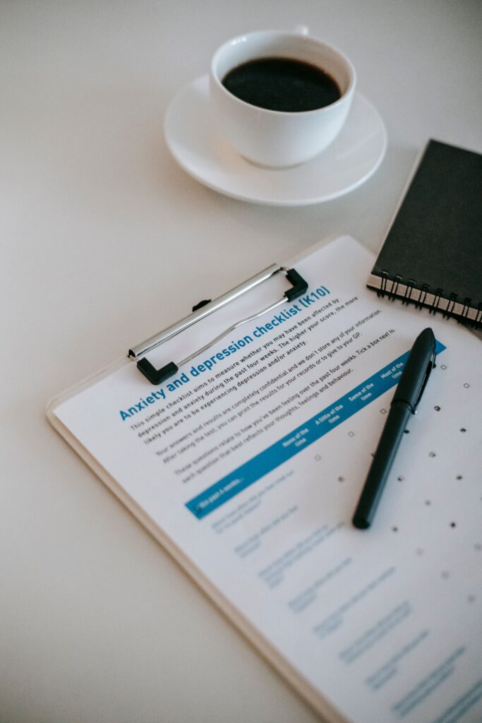 Anxiety and depression check list on a clipboard with a cup of coffee. Support for mental health disorders in the DMV area by licensed mental health professional, Dr. Jennifer Melo.